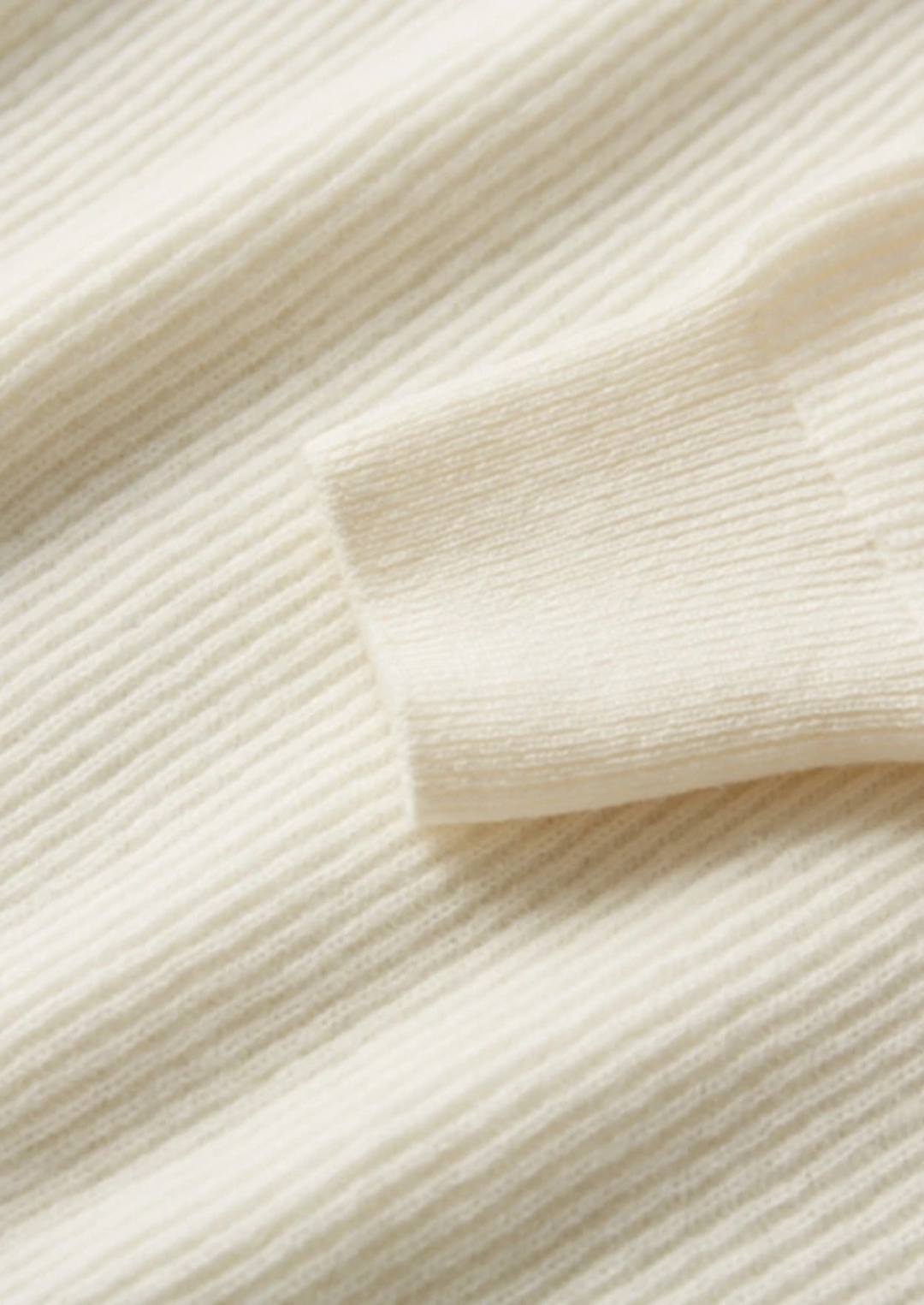 100% CASHMERE BUTTON SWEATER.