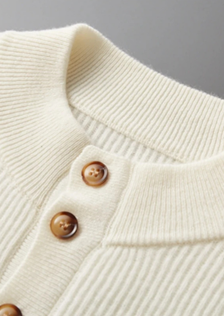 100% CASHMERE BUTTON SWEATER.