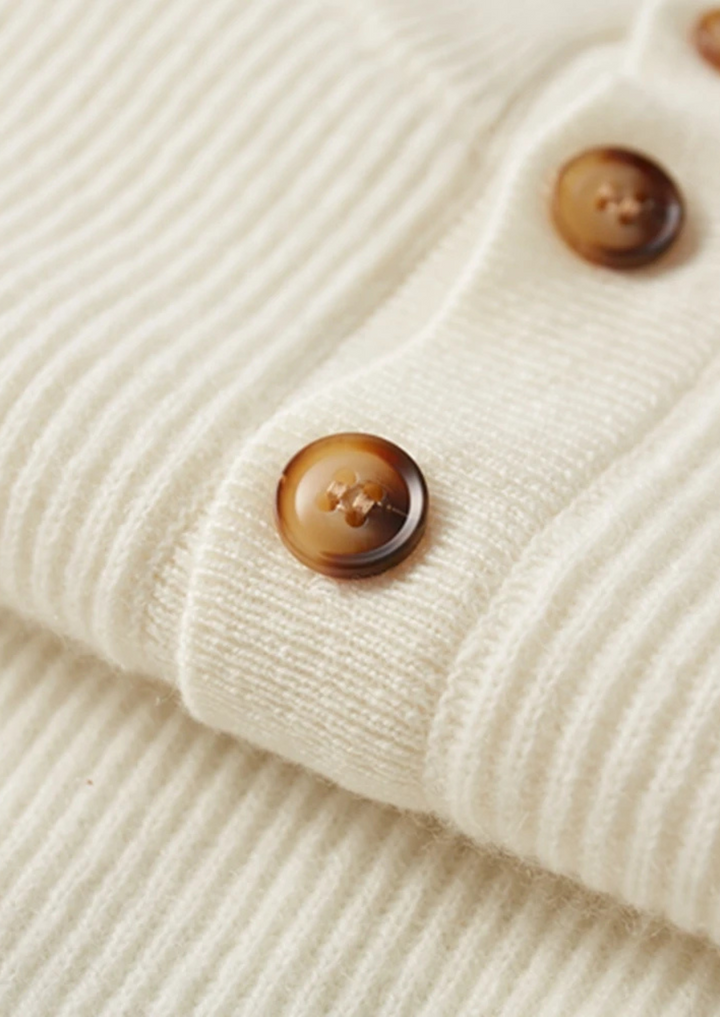 100% CASHMERE BUTTON SWEATER.