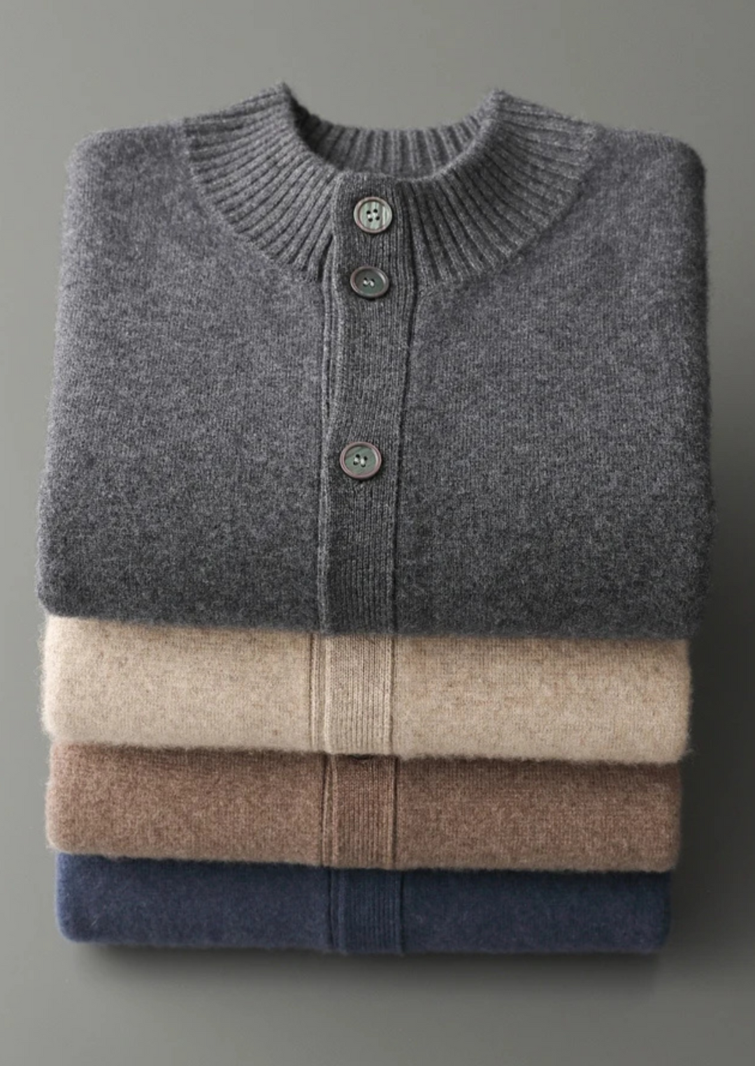 100% CASHMERE BUTTON CARDIGAN.
