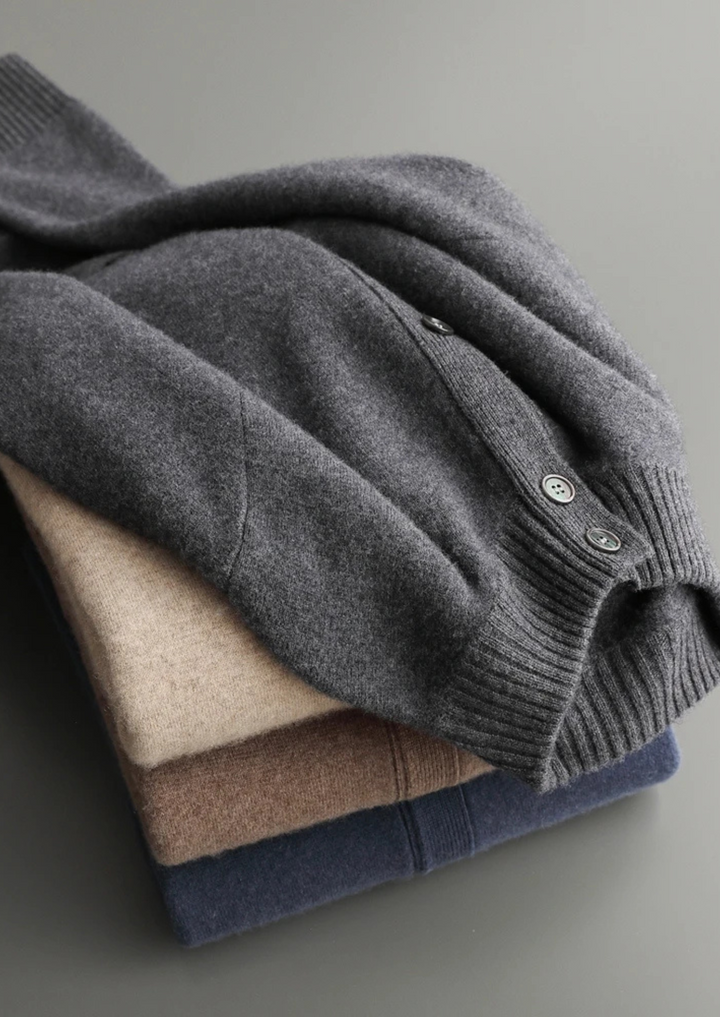 100% CASHMERE BUTTON CARDIGAN.