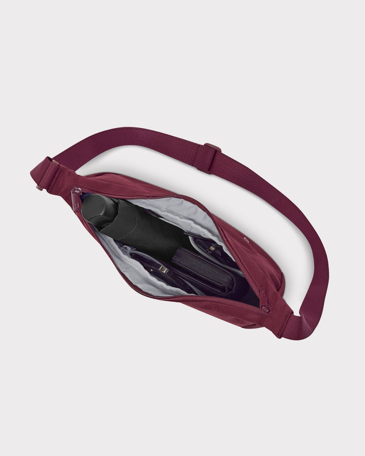 The Ally Medium Half-Moon Bag keeps your daily essentials organized