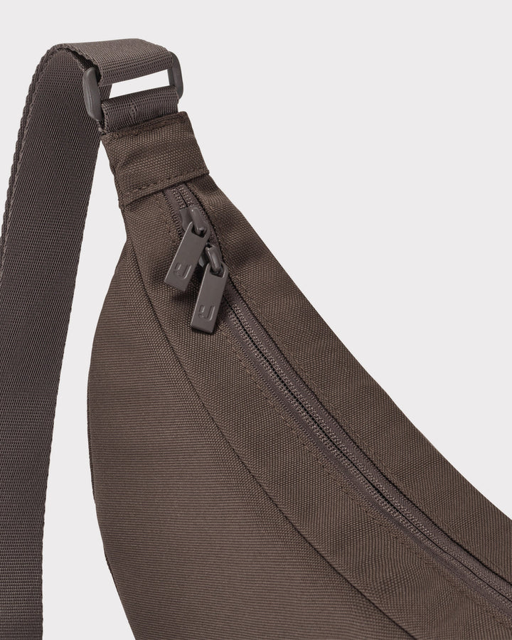 The Ally Medium Half-Moon Bag keeps your daily essentials organized