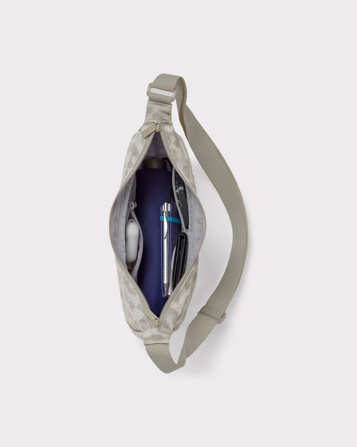 The Ally Medium Half-Moon Bag keeps your daily essentials organized