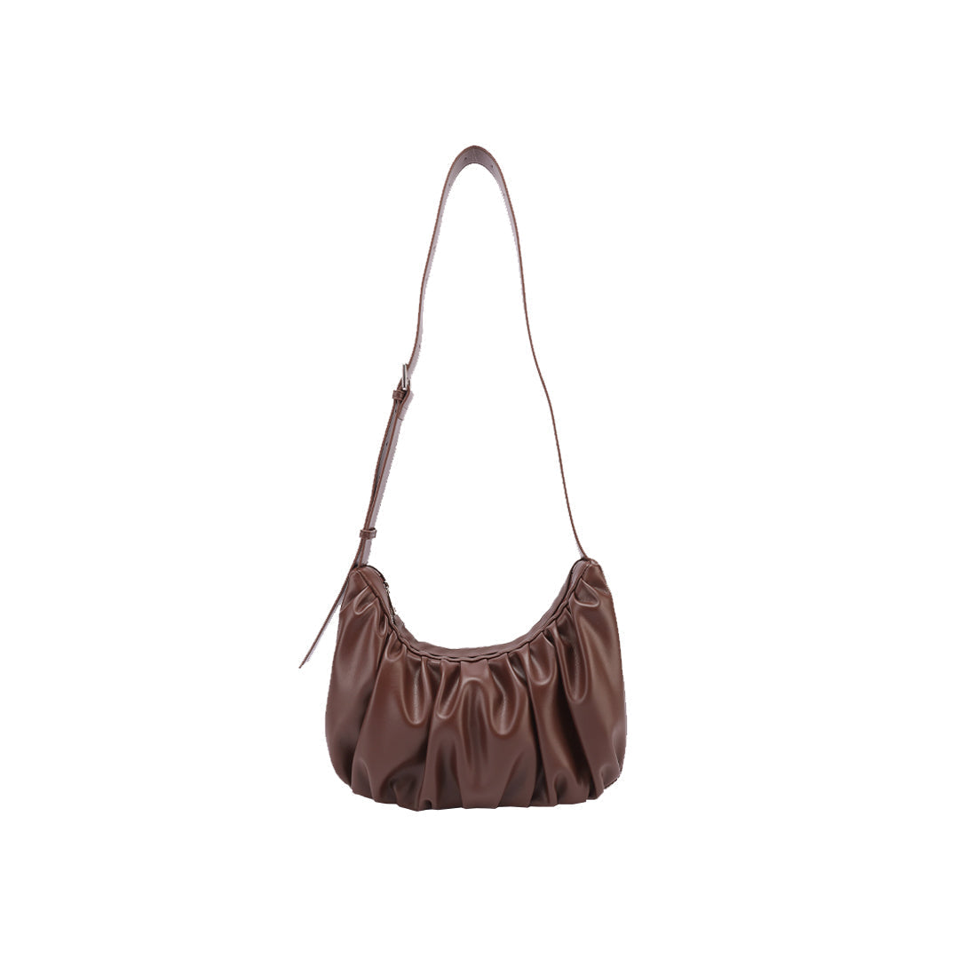 Chara | Croissant-shaped leather sling bag