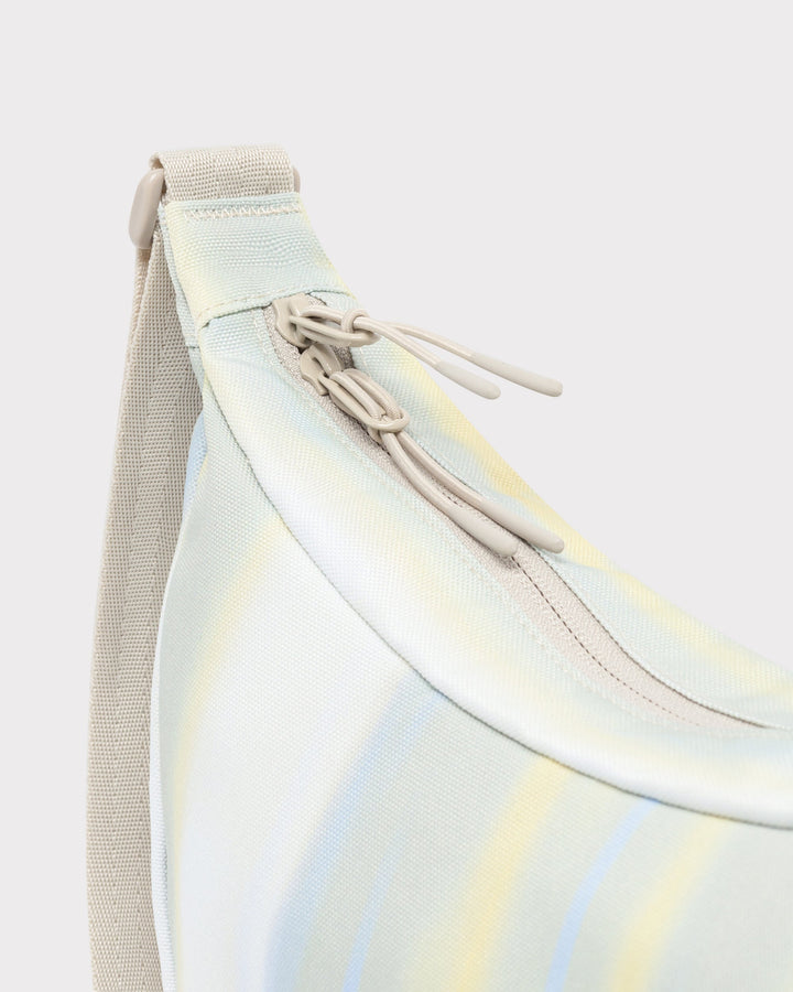 The Ally Medium Half-Moon Bag keeps your daily essentials organized
