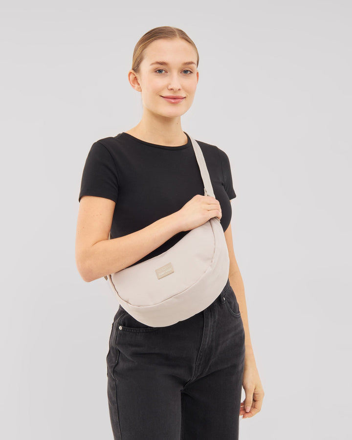 The Ally Medium Half-Moon Bag keeps your daily essentials organized