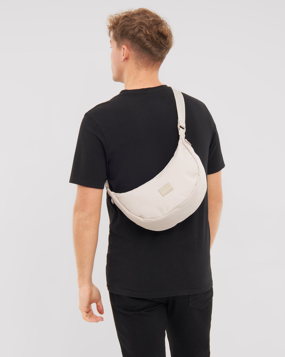 The Ally Medium Half-Moon Bag keeps your daily essentials organized