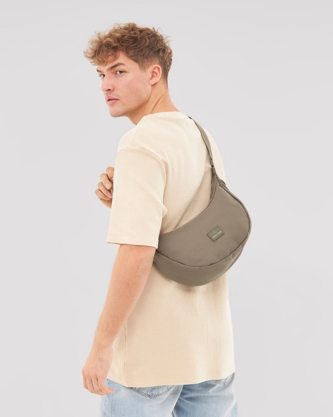 The Ally Medium Half-Moon Bag keeps your daily essentials organized