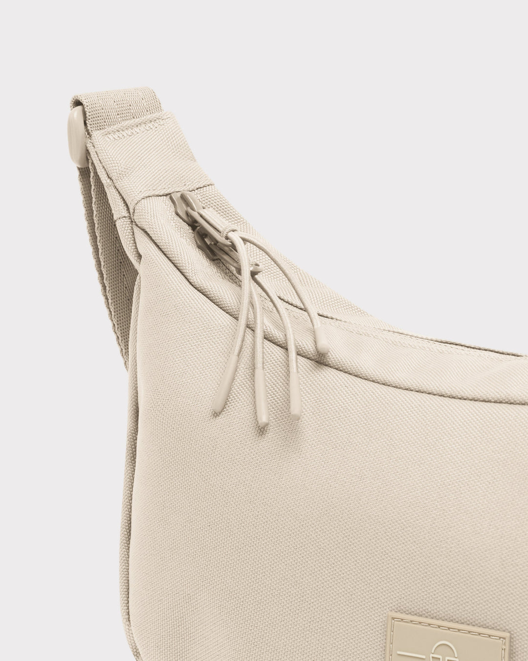 The Ally Medium Half-Moon Bag keeps your daily essentials organized