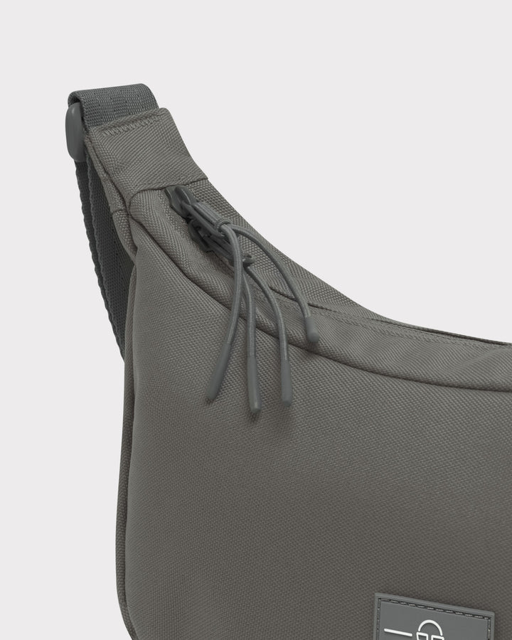The Ally Medium Half-Moon Bag keeps your daily essentials organized