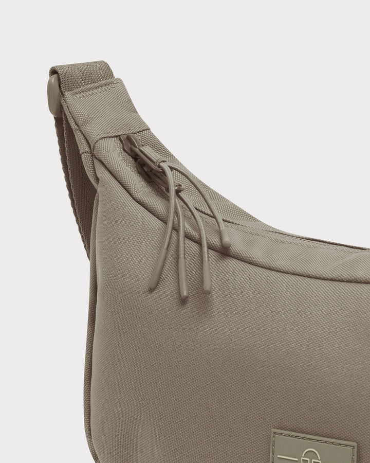 The Ally Medium Half-Moon Bag keeps your daily essentials organized