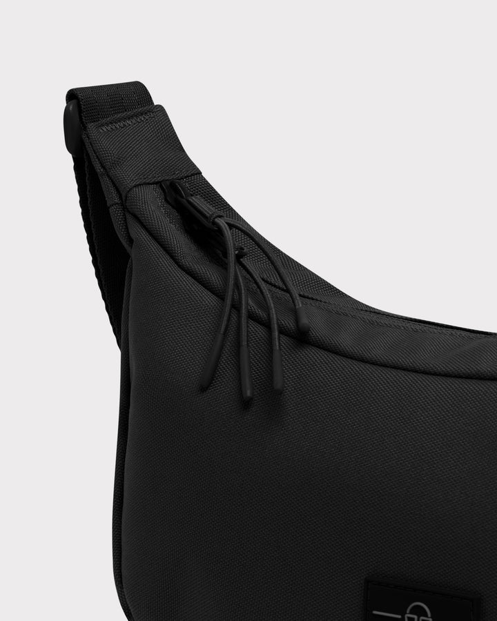 The Ally Medium Half-Moon Bag keeps your daily essentials organized