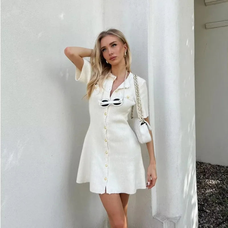 Carmenza - Elegant fine knit dress with golden buttons