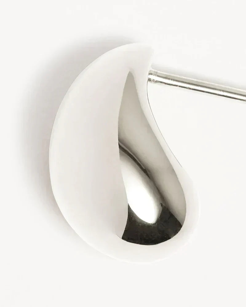 Elegant white gold earrings with subtle dangling elements