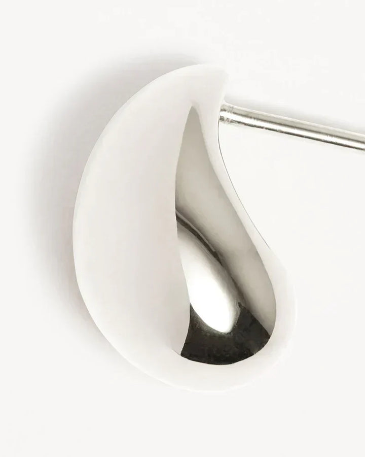Elegant white gold earrings with subtle dangling elements