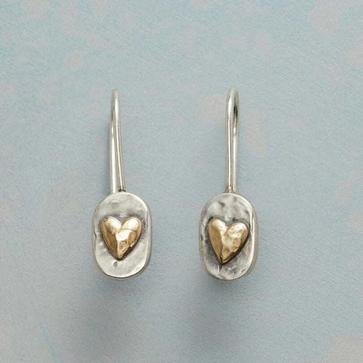 Elegant gold earrings with little heart