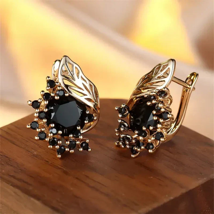 Elegant gold earrings with black cubic zirconia